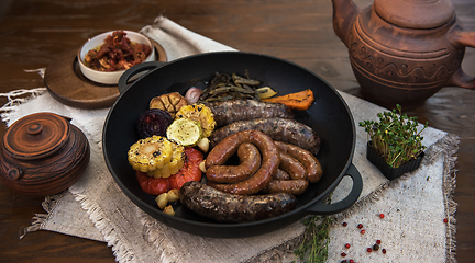 Image showing Grilled sausages with vegetables