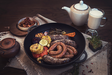 Image showing Grilled sausages with vegetables