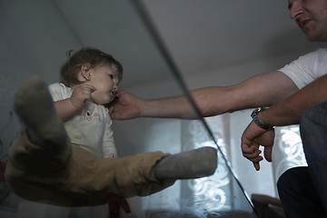 Image showing Little child playing with sister at home