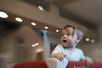 Image showing cute little baby playing in mobile bed