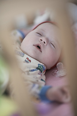 Image showing newborn baby sleeping at home in bed