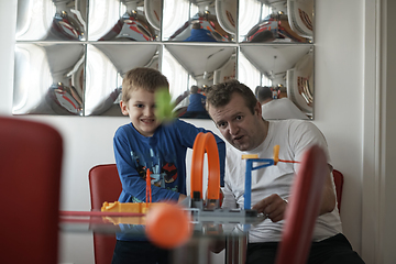 Image showing Father and children playing car toy game