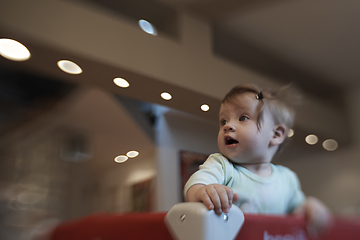 Image showing cute little baby playing in mobile bed