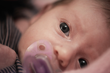 Image showing One month newborn baby sleeping in bed