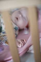 Image showing newborn baby sleeping at home in bed