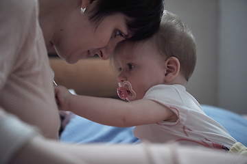 Image showing mother is playing with baby at home