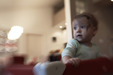 Image showing cute little baby playing in mobile bed