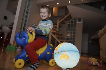 Image showing Little boy child playing with creative toys