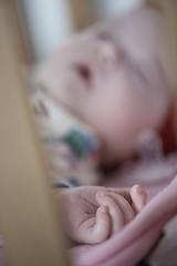 Image showing newborn baby sleeping at home in bed