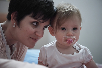 Image showing mother is playing with baby at home