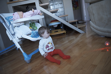 Image showing cute little one year old baby and making first steps