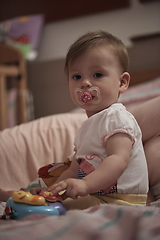 Image showing cute little one year old baby and making first steps