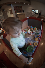 Image showing cute little baby playing in mobile bed