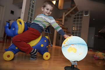 Image showing Little boy child playing with creative toys