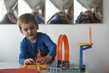 Image showing Father and children playing car toy game