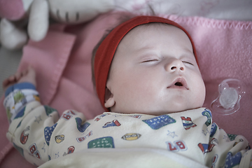 Image showing newborn baby sleeping at home in bed