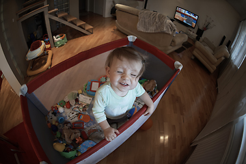 Image showing cute little baby playing in mobile bed