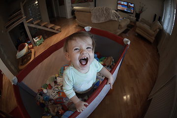 Image showing cute little baby playing in mobile bed