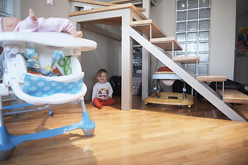 Image showing cute little one year old baby and making first steps