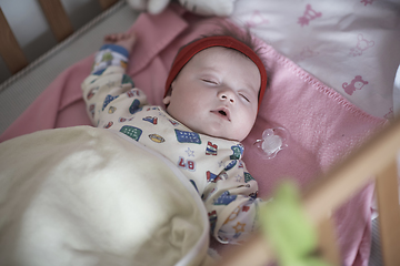 Image showing newborn baby sleeping at home in bed