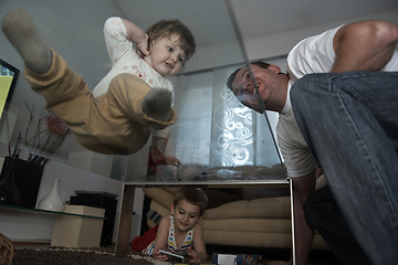 Image showing Little child playing with sister at home