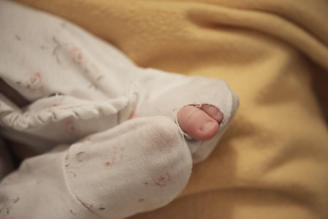 Image showing One month newborn baby sleeping in bed