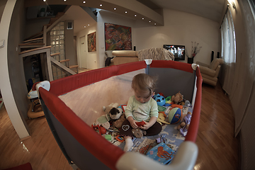 Image showing cute little baby playing in mobile bed