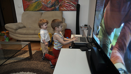 Image showing Little child playing with sister at home