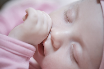 Image showing newborn baby sleeping at home in bed