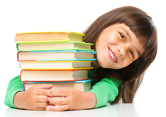 Image showing Little girl with her books