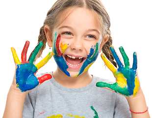 Image showing Portrait of a cute girl playing with paints