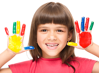 Image showing Portrait of a cute girl playing with paints