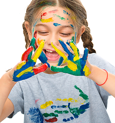 Image showing Portrait of a cute girl playing with paints