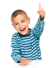 Image showing Little boy is showing thumb up sign
