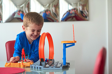 Image showing Father and children playing car toy game