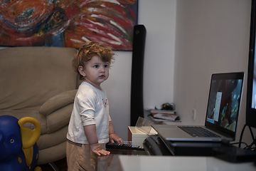 Image showing Adorable cute beautiful little baby girl playing with toys at home