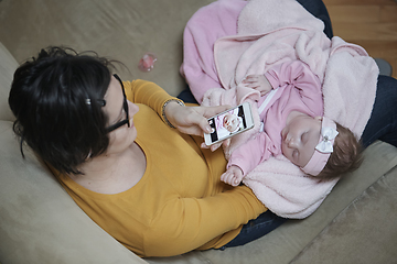 Image showing mother is playing with baby at home