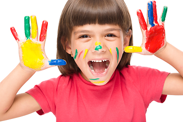 Image showing Portrait of a cute girl playing with paints