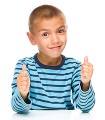 Image showing Portrait of a cute boy showing thumb up sign