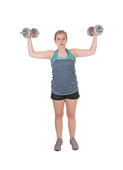 Image showing Young woman lifting two dumbbell's