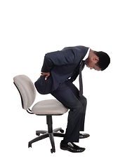 Image showing Man with back pain getting up from chair