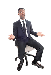 Image showing Sitting business man is confused, wondering