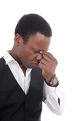 Image showing Depressed African man with hand on face
