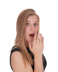 Image showing Woman telling an secret behind her hand