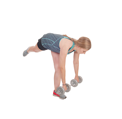Image showing Young woman working out with two dumbbell's