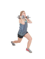 Image showing Young woman lifting her two dumbbell's