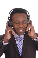 Image showing Business man listening to music