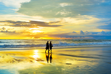 Image showing Couple walking by the  beach 