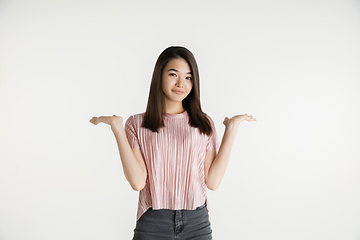 Image showing Beautiful girl\'s half-length portrait on white studio background