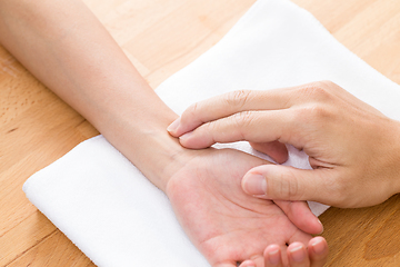 Image showing Doctor checking patients pulse rate 